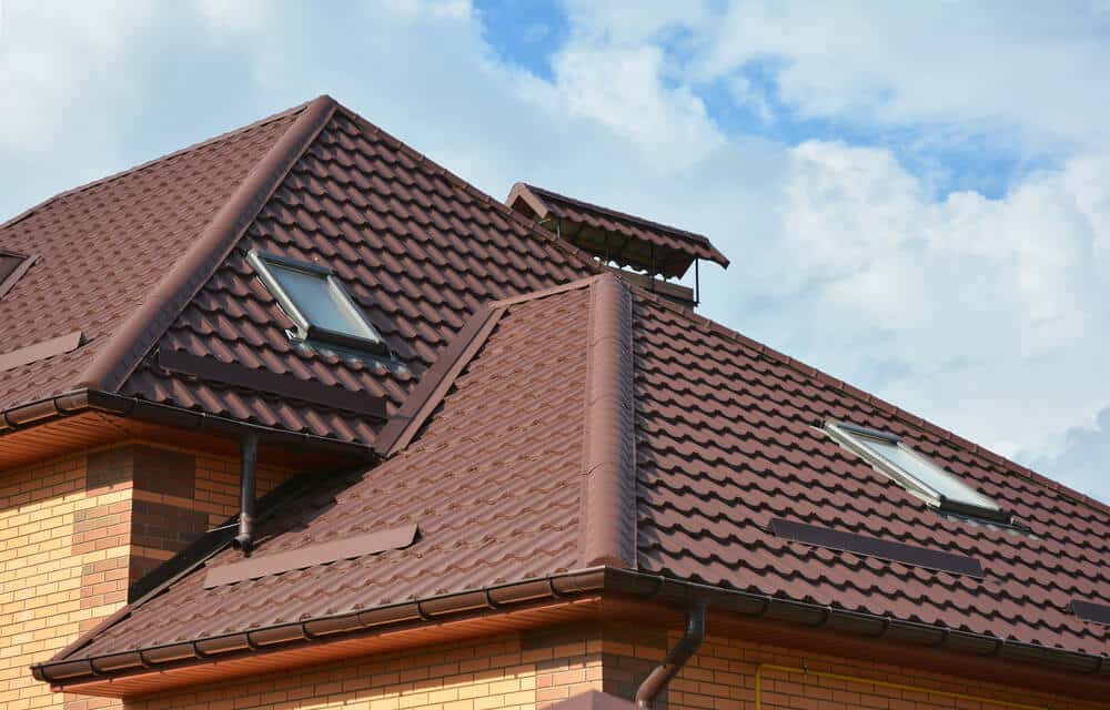 A house with a brown roof and two windows - Big Easy Roof Repairs